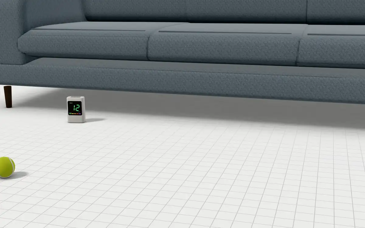 Illustration of the 5 hand vacuums to scale, next to a fabric sofa, a tennis ball and an air-quality monitor for size